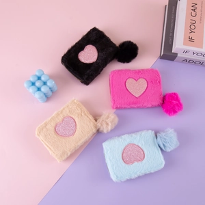 Furry heart coin purses with sequin patches and fluffy pompoms in multiple colors