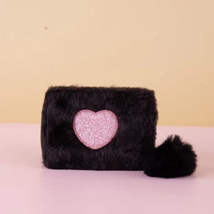 Fuzzy black faux fur storage pouch with a pink glitter heart and soft fur ball charm