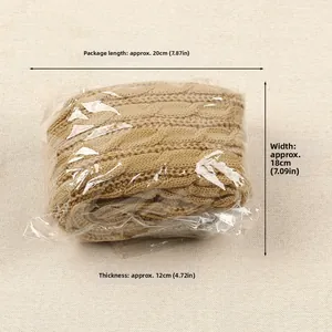 Detailed view of knitted leg warmers in a compact package with dimensions labels