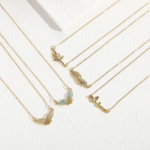 Golden butterfly zircon MOM necklace set featuring heart and infinity pendants on white stone