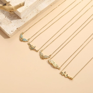 Detail of MOM necklaces with butterfly and heart zircon pendants in gold finish