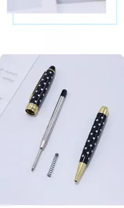 Disassembled view showing metal refill, spring, and dotted pen barrel components