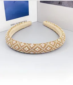 Close-up of wide padded headband with AB rhinestones and diamond lattice pattern design