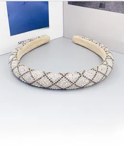 Detail of wide padded headband with rhinestone diamonds in a vintage lattice pattern