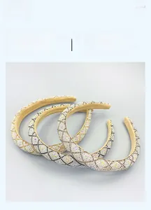 Close-up of padded headband with sparkling rhinestones in a classic lattice pattern