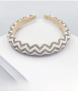Detail of wide headband with pearls and rhinestones on anti-slip velvet lining