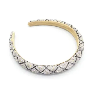 Retro padded headband with rhinestone diamond pattern and champagne velvet inner lining