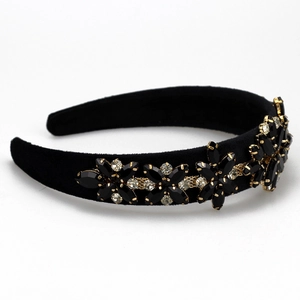Detailed close-up of Baroque black velvet headband with sunflower crystal rhinestones