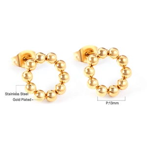 Detailed view of 13mm gold plated stainless steel beaded hoop earrings on white background