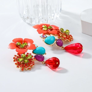 Macro detail of colorful floral drop earrings with rhinestones and multi-color resin petals