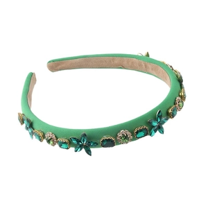 Grass green mesh headband featuring sparkling emerald crystals and rhinestones