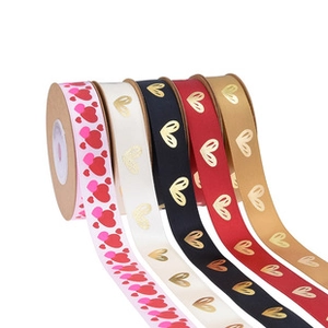 Close-up of assorted heart pattern ribbons for wedding gift packaging and decoration