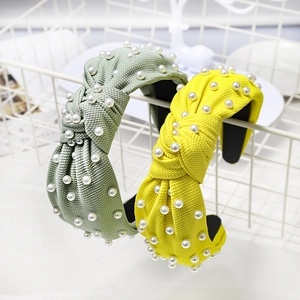 Knotted waffle knit headbands with pearls in light green and bright yellow colors