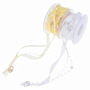 Detail of sheer organza ribbon with pearl chain and heart metal pendant for gifts