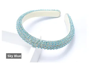 Close-up of sparkling sky blue rhinestones on a padded headband with elegant design