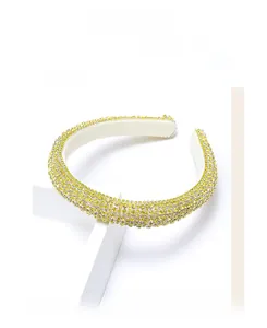 Detail of lemon yellow rhinestone padded headband with sparkling crystal embellishment