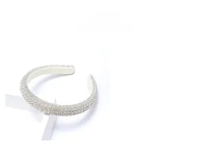 Detailed macro view showing high-density sparkling white rhinestones on wide padded headband