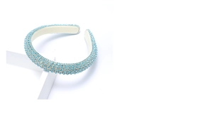 Detail of light blue crystal headband with thick padded design for volume and comfort