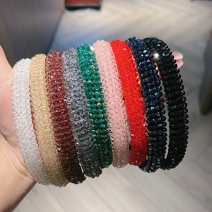 Detailed view of nine vibrant crystal headbands with multi-faceted sparkling beads