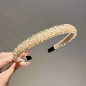 Detailed view of champagne crystal beads on a non-slip luxury headband for women