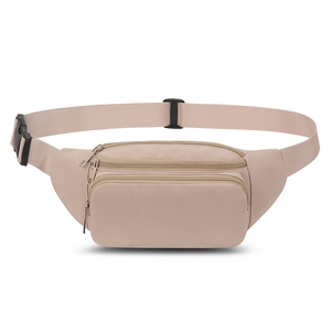 Macro detail of beige nylon sports waist bag showing three zippers and adjustable strap