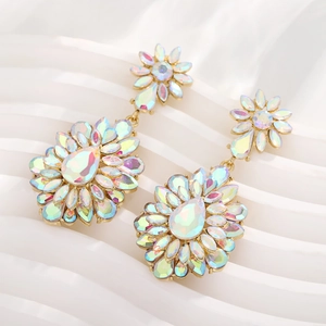 Macro detail of teardrop floral earrings with AB iridescent crystals on gold base