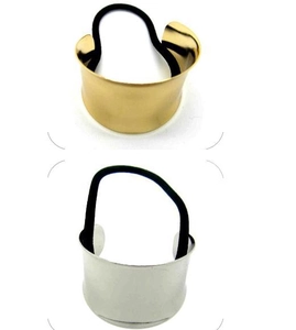 Close-up of polished gold and silver hair cuffs with elastic bands for ponytails