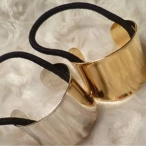 Minimalist metallic gold and silver hair ties with smooth polished ring design