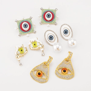 Boucles d'oreilles vintage style français avec perles et strass motif œil de démon