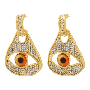 Détails des boucles d'oreilles œil vintage avec cristaux et pupilles réalistes