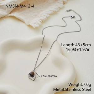 Spécifications du collier en acier avec pendentif cœur œil de tigre sur plateau céramique