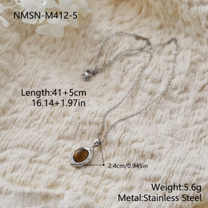Détails de la taille du pendentif œil de tigre sur collier en acier inoxydable