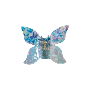 3D butterfly hair claw clip with blue marble acetate pattern and gold spring