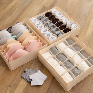 Detailed view of beige breathable fabric organizer bins for underwear and socks