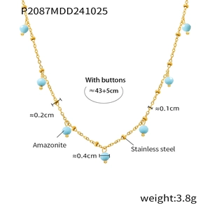 Macro detail of 18K gold-plated stainless steel necklace with blue amazonite beads