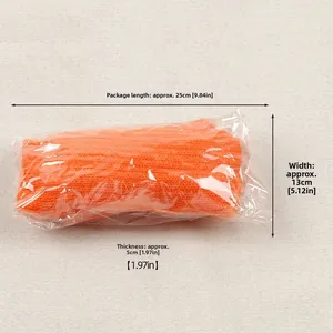 Orange knitted leg warmers set in transparent packaging showing item dimensions and size