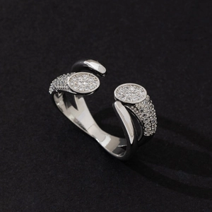 Elegant minimalist silver wrap ring featuring sparkling pavé set oval details and stones