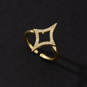 Close-up view of a minimalist gold star-shaped open ring with cubic zirconia stones