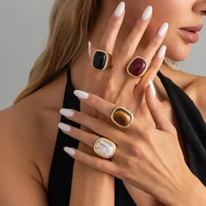 Retro oversized gold rings set with colorful gemstones in vintage embossed metal frames