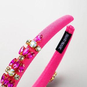 Handmade magenta fabric headband with geometric rhinestones and crystal accents
