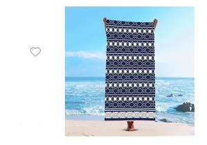 Detail of navy and white geometric pattern on quick-drying microfiber beach towel