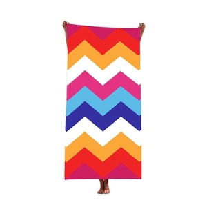 Fashionable quick-dry beach towel featuring a colorful geometric chevron pattern for women