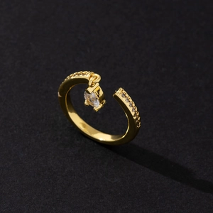 Detail of adjustable gold ring featuring marquise-cut zircon and shimmering crystal pavé