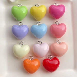 Detailed set of 11 colorful heart-shaped resin pendants with silver metal loop hooks