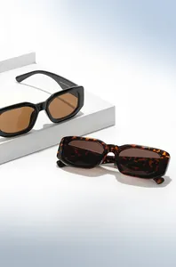 Detail of vintage square sunglasses with thick frames on minimalist geometric stands