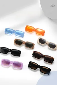 Flat lay of retro rectangle sunglasses in various vibrant colors on white background