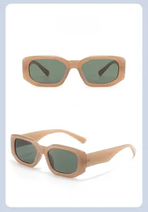 Macro detail of retro square brown amber sunglasses with dark grey green lenses