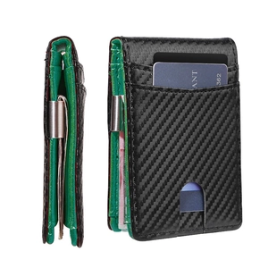 Detail of carbon fiber wallet with green leather lining and stainless steel money clip