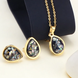 Elegant water drop necklace and earrings set with gold finish and black stone inlays