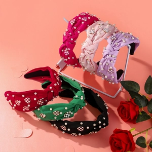 Detailed set of six knotted fabric headbands with pearls and checkered heart charms